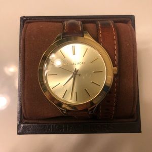 Women’s Michael Kors gold tone leather wrap watch